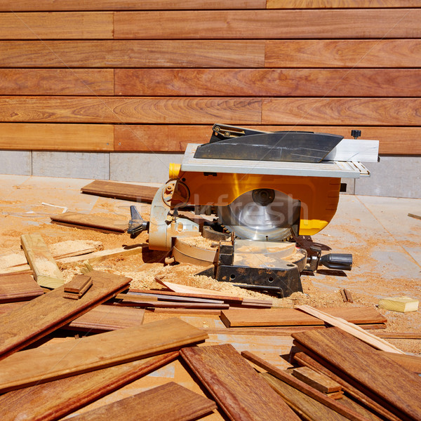 Stock photo: Ipe wood fence installation carpenter table saw