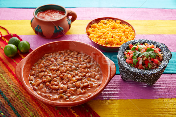 Frijoles mexican beans with rice and sauces Stock photo © lunamarina