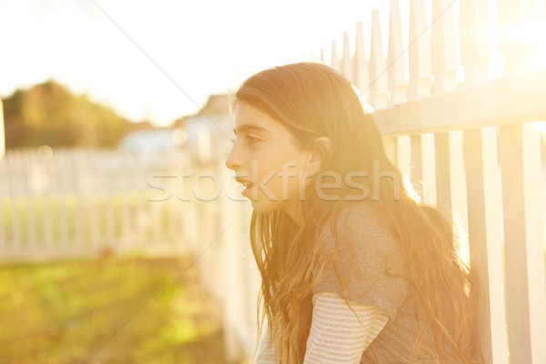 Tween kid girl profile in the park at sunset Stock photo © lunamarina