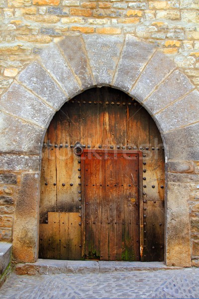 Romanesque arch door wooden medieval Ainsa Stock photo © lunamarina