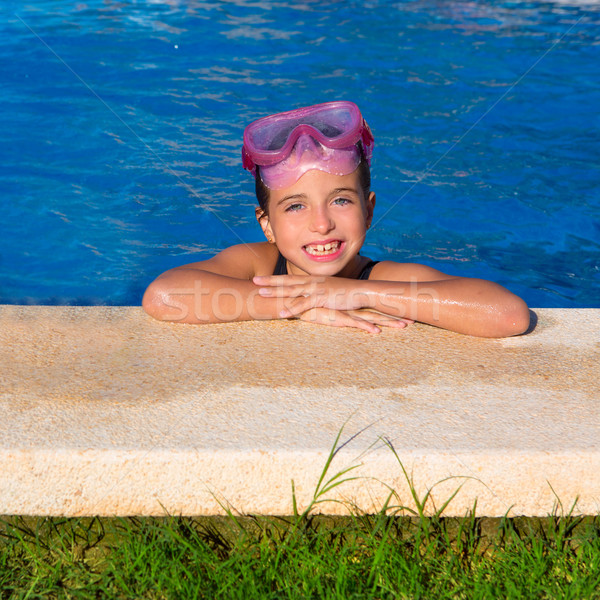 Blue eye kid girl on on blue pool poolside smiling Stock photo © lunamarina