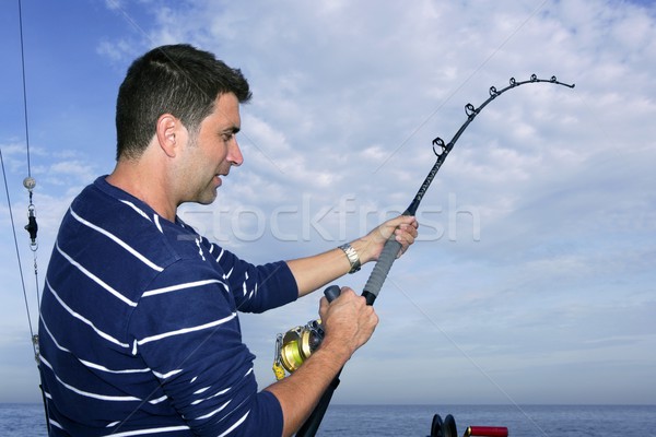 Angler Fischer kämpfen groß Fisch Stange Stock foto © lunamarina