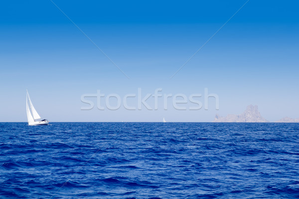 Ibiza Es Vedra and sailboat in blue mediterranean Stock photo © lunamarina