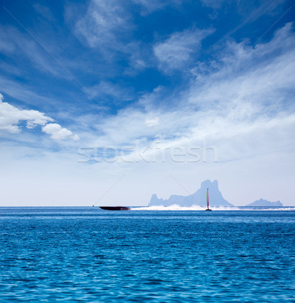 Es Vedra Ibiza silhouette with boats Formentera view Stock photo © lunamarina