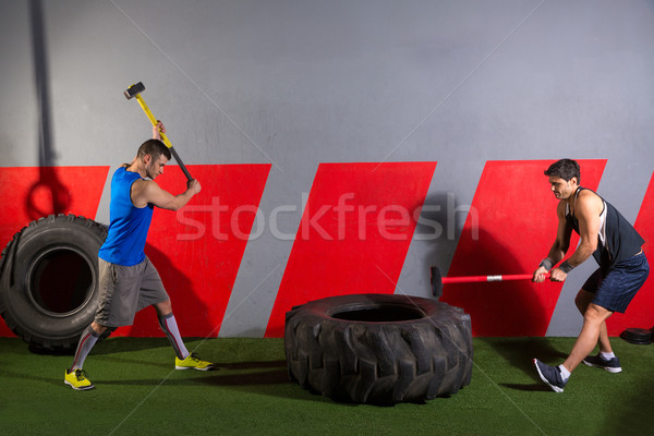 Sledgehammer Tire Hits men workout at gym Stock photo © lunamarina