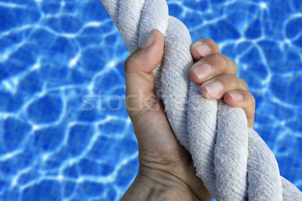 man hand grab grip sport blue pool big rope Stock photo © lunamarina