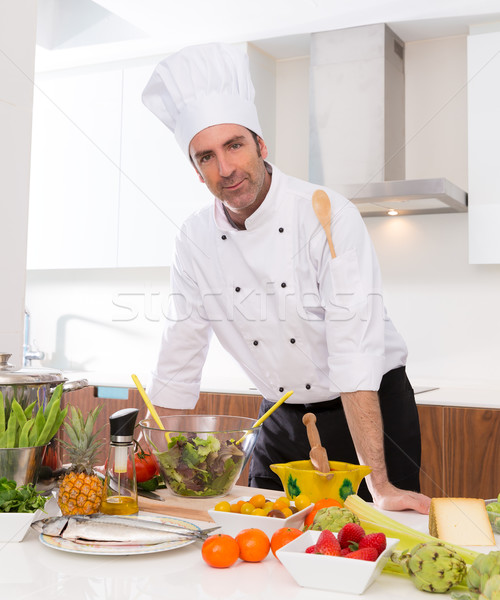 Chef male portrait on white countertop at kitchen Stock photo © lunamarina