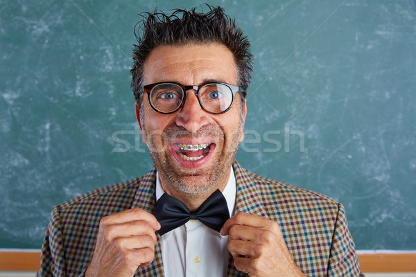 Nerd silly retro man with braces funny expression Stock photo © lunamarina