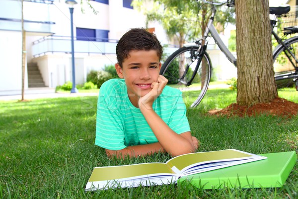 Stock photo: boy teen studying laying green grass garden