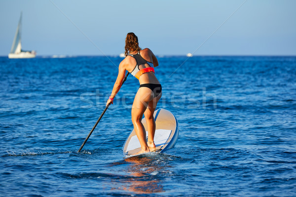 Stock photo: SUP Stand up Surf girl with paddle
