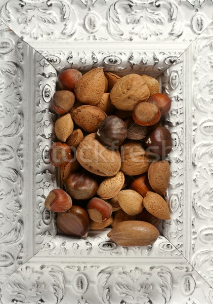 wooden decorated classic white frame, varied nuts Stock photo © lunamarina