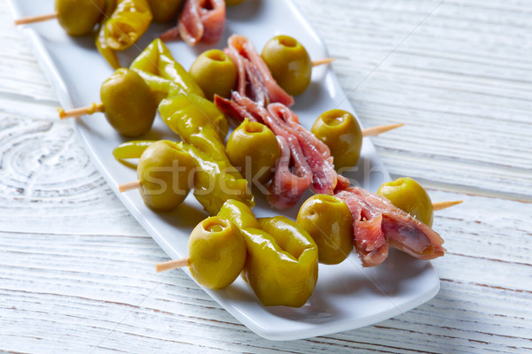 Gilda pinchos with olives and anchovies tapas Stock photo © lunamarina
