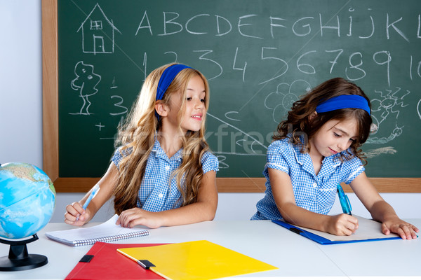 classroom with two kids students cheating on test Stock photo © lunamarina