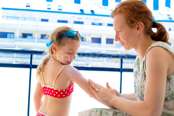 children girl with mother applying sunscreen Stock photo © lunamarina