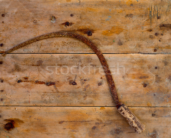 Antique sickle hand tool rusted on aged vintage wood Stock photo © lunamarina