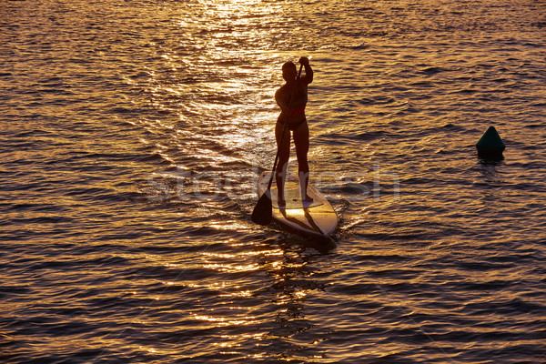SUP Stand up Surf girl with paddle Stock photo © lunamarina