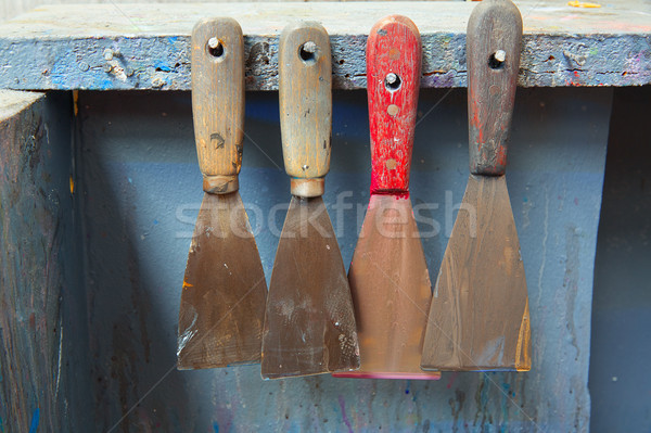 four ink spatulas in a row at a printing company Stock photo © lunamarina