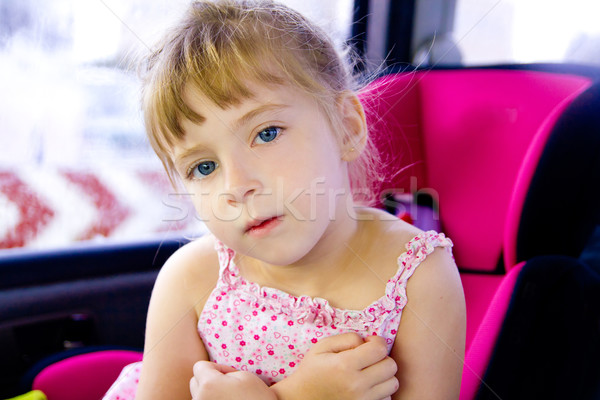 blond child girl sitting in car safety seat Stock photo © lunamarina