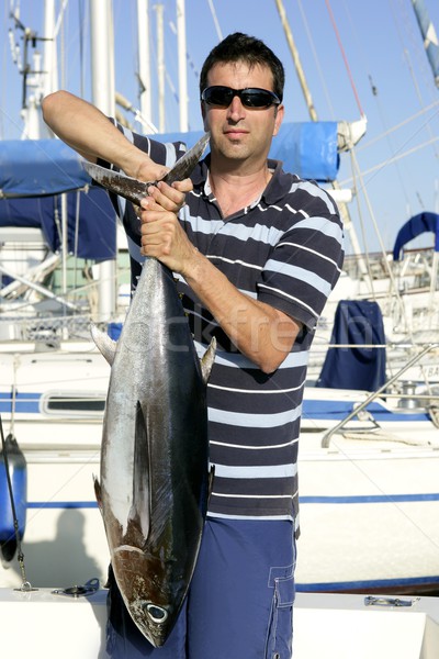 Big game fisherman with saltwater tuna Stock photo © lunamarina
