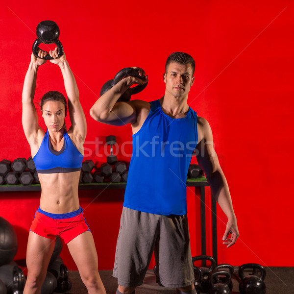 Stock photo: Kettlebell swing workout training group at gym