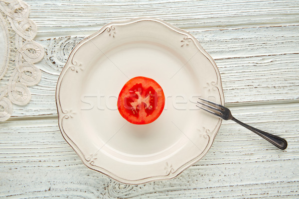 cut half tomato in white plate minimalist food Stock photo © lunamarina