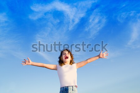 Girl open arms outdoor under blue sky Stock photo © lunamarina