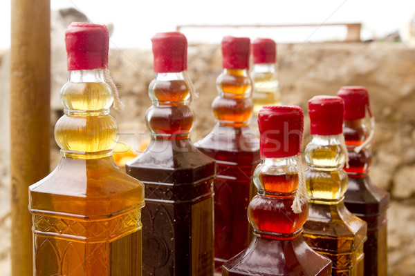colorful traditional liquor bottles in rows Stock photo © lunamarina