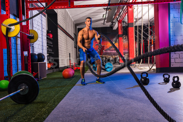 battling ropes man at gym workout exercise Stock photo © lunamarina