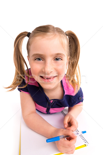 Blond kid girl student with spiral notebook in desk Stock photo © lunamarina