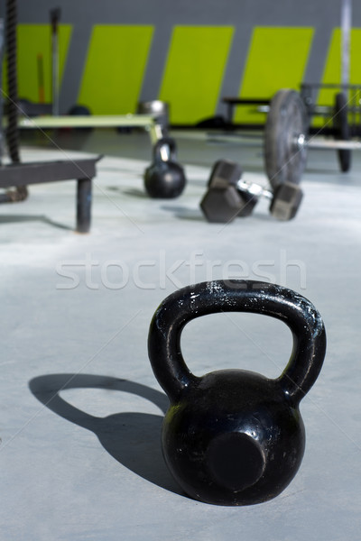 Stock photo: Kettlebell at crossfit gym with lifting bars