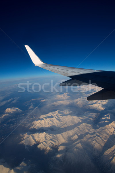 aircraft flying over snowed mountains of Pyrenees Stock photo © lunamarina