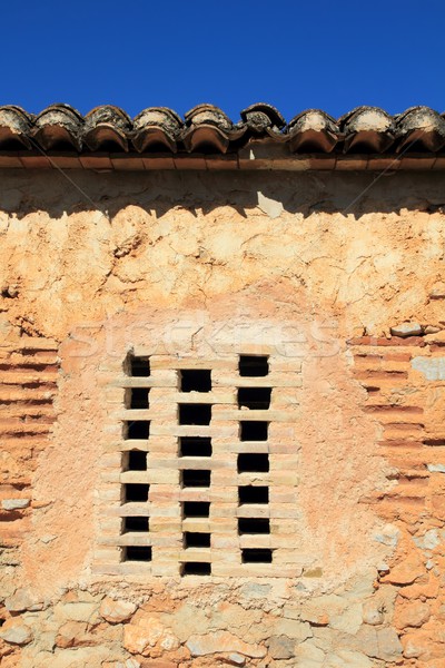 Téglák ablak kőművesmunka fal ősi építészet Stock fotó © lunamarina