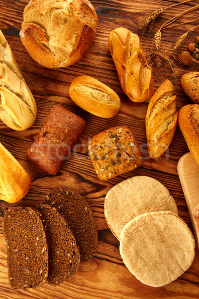 Bread varied mix on golden aged wood table Stock photo © lunamarina