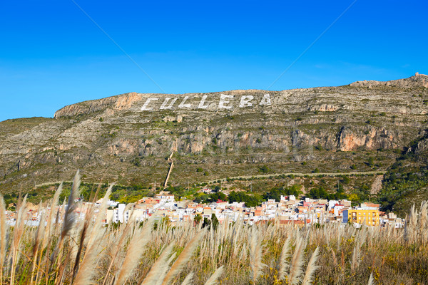 Cullera mountain with white sign writted on in Stock photo © lunamarina