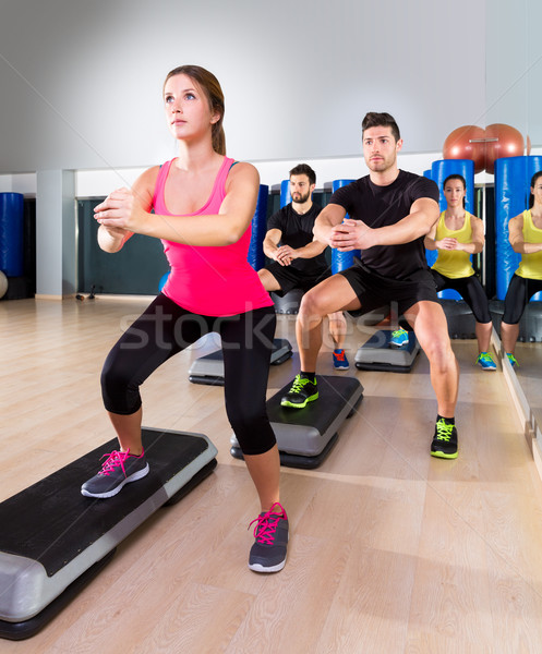 Cardio step dance squat group at fitness gym Stock photo © lunamarina