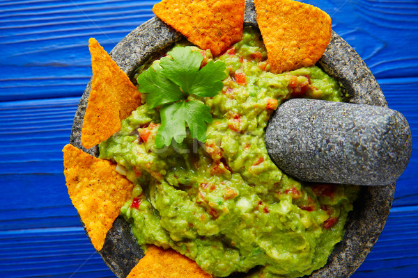 Guacamole with nachos in Mexican molcajete Stock photo © lunamarina