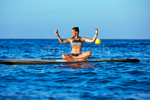 Stock photo: Yoga girl over SUP Stand up Surf board