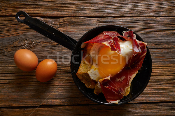 Stock photo: Tapas huevos rotos broken eggs with ham