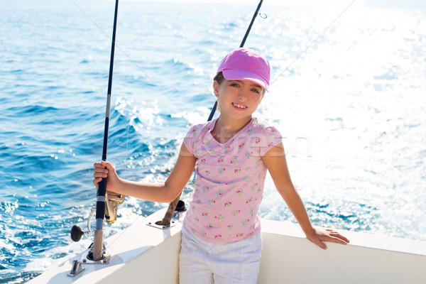Stock photo: child girl sailing in fishing boat holding rod