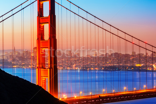 San Francisco Golden Gate Bridge sunrise through cables Stock photo © lunamarina