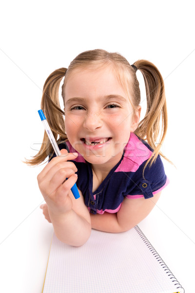 Stock photo: Blond kid girl student with spiral notebook in desk