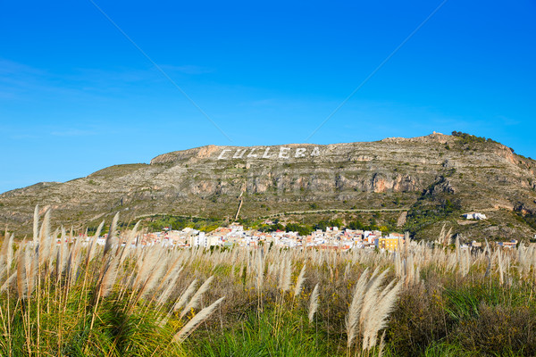 Cullera mountain with white sign writted on in Stock photo © lunamarina