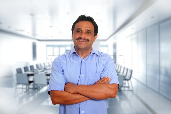 Indian latin businessman blue shirt in boardroom Stock photo © lunamarina