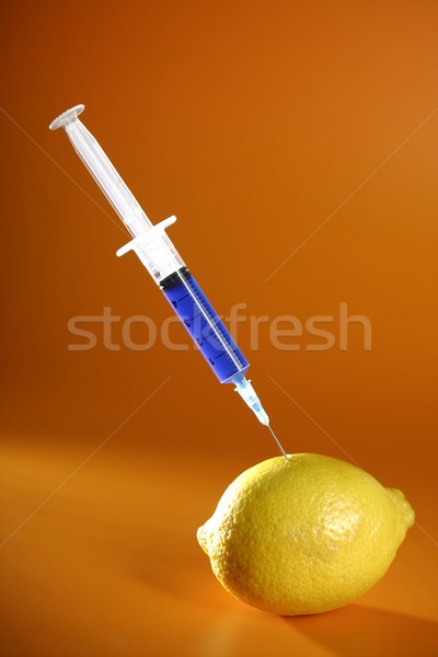 lemon manipulation with syringe Stock photo © lunamarina