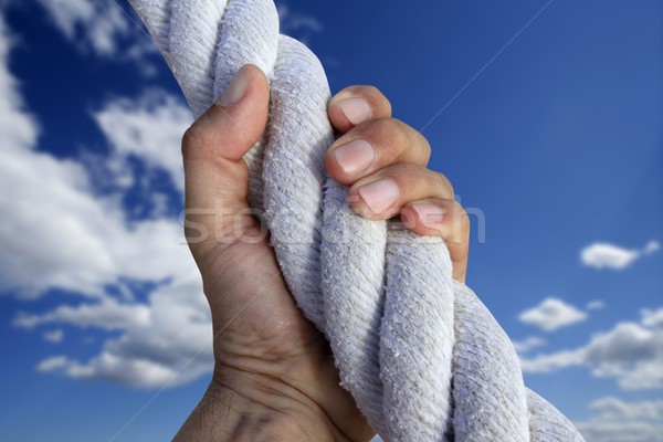 Férfi kéz markolás erős mászik égbolt Stock fotó © lunamarina