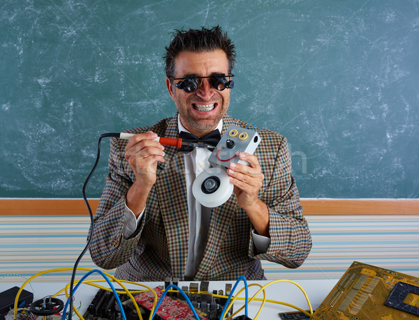 Nerd electronics technician silly welding robot Stock photo © lunamarina