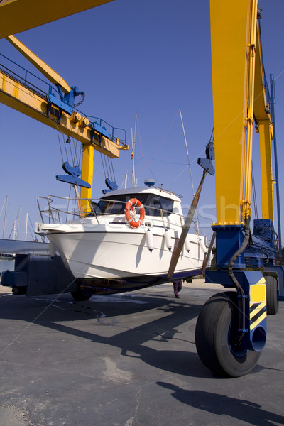 boat crane travelift lifting motorboat Stock photo © lunamarina