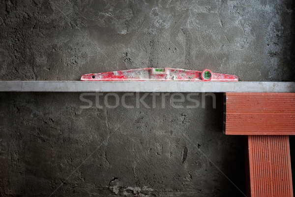 bubble spirit level tool in red on costruction cement Stock photo © lunamarina