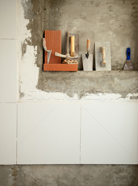 Construction maçon ciment outils rangée bâtiment Photo stock © lunamarina