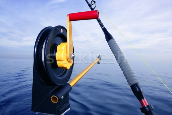 Downrigger angler fishing tackle in blue sea Stock photo © lunamarina